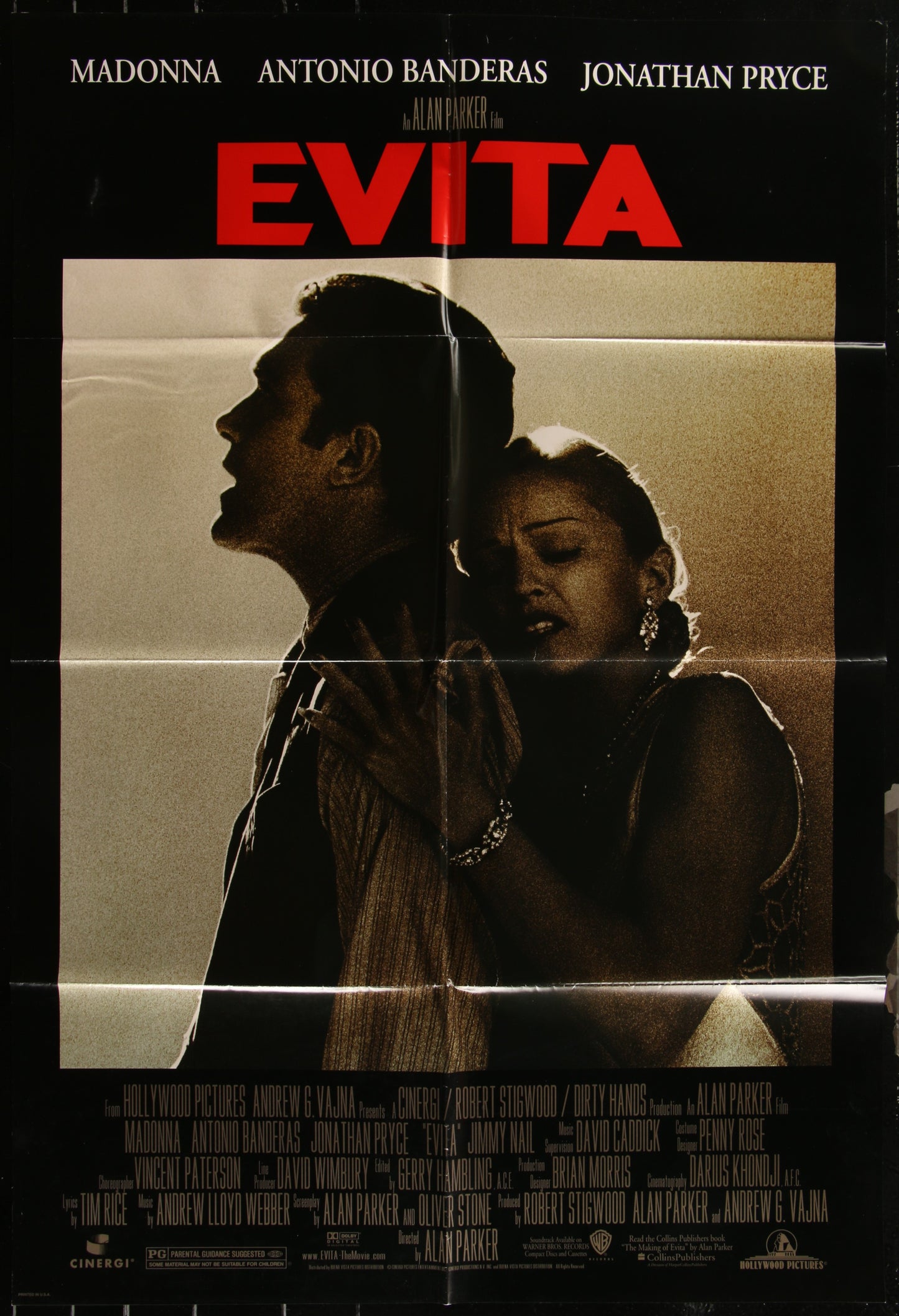An authentic 27" x 40" folded one-sheet movie poster for the 1996 biographical musical drama 'Evita', featuring key cast members including Madonna and Antonio Banderas.