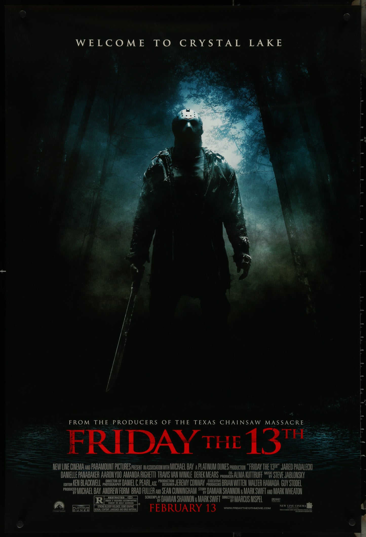 A one sheet movie poster for 'Friday The 13th (2009)', featuring a dark image of the character Jason Voorhees with a creepy smile, surrounded by a dark and misty background. The poster has a 'Welcome to Crystal Lake' text at the top and 'Friday The 13th' text at the bottom.