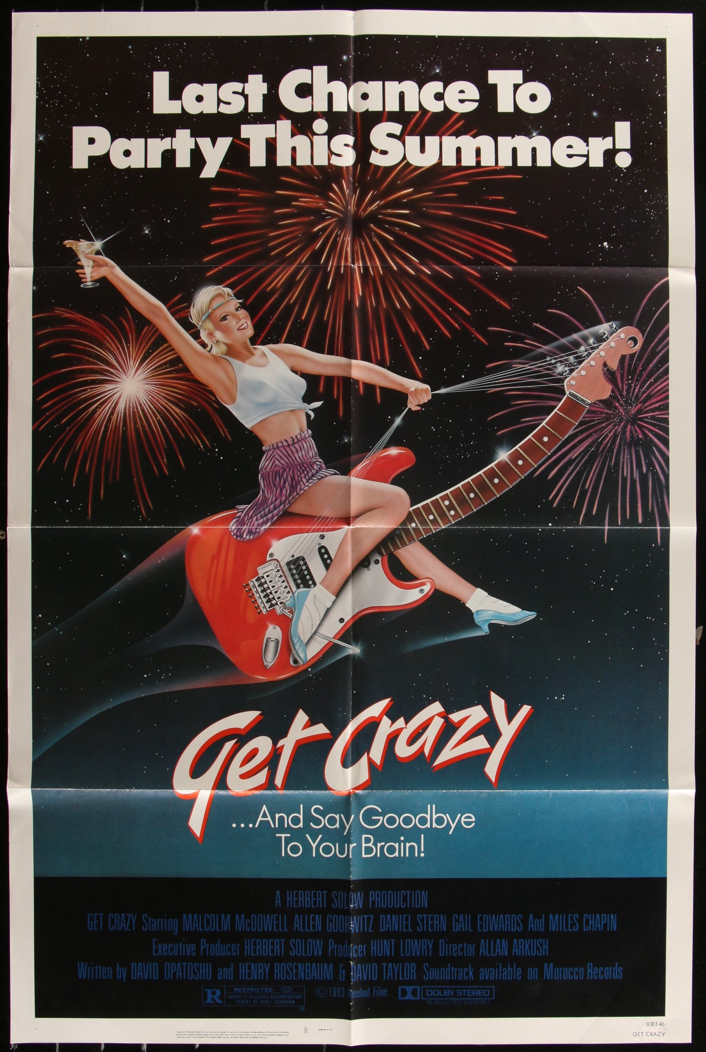 Vintage style movie poster for 'Get Crazy' featuring a woman sitting on a red guitar with a background of fireworks and stars.