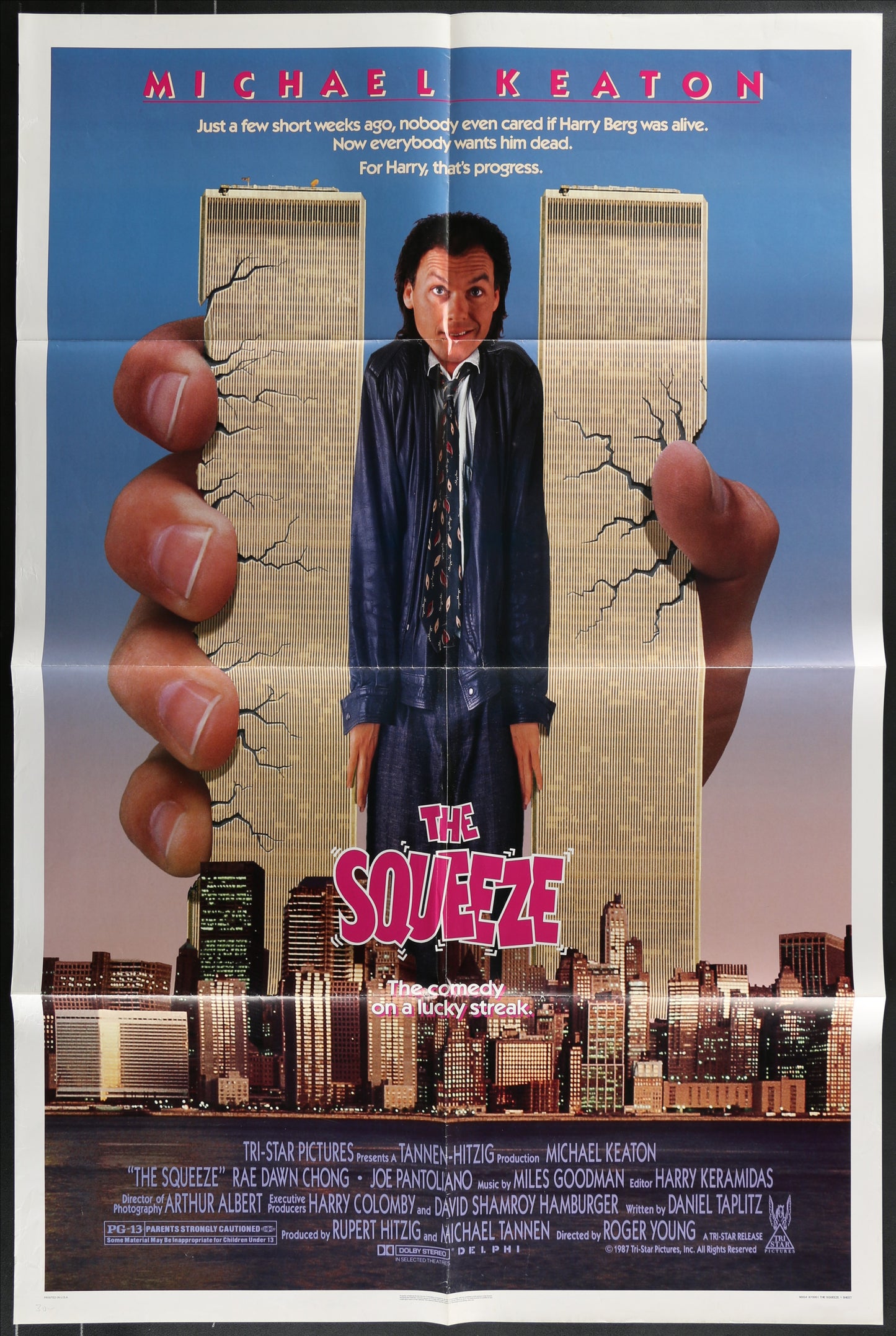 "Original US one sheet movie poster for The Squeeze (1987). Action comedy thriller starring Michael Keaton and Rae Dawn Chong. Vintage folded poster (27 x 41 inches) featuring Keaton and Chong in dramatic pose against New York City backdrop. Minor wear on fold lines and edges consistent with age. Classic 80s crime film collectible.