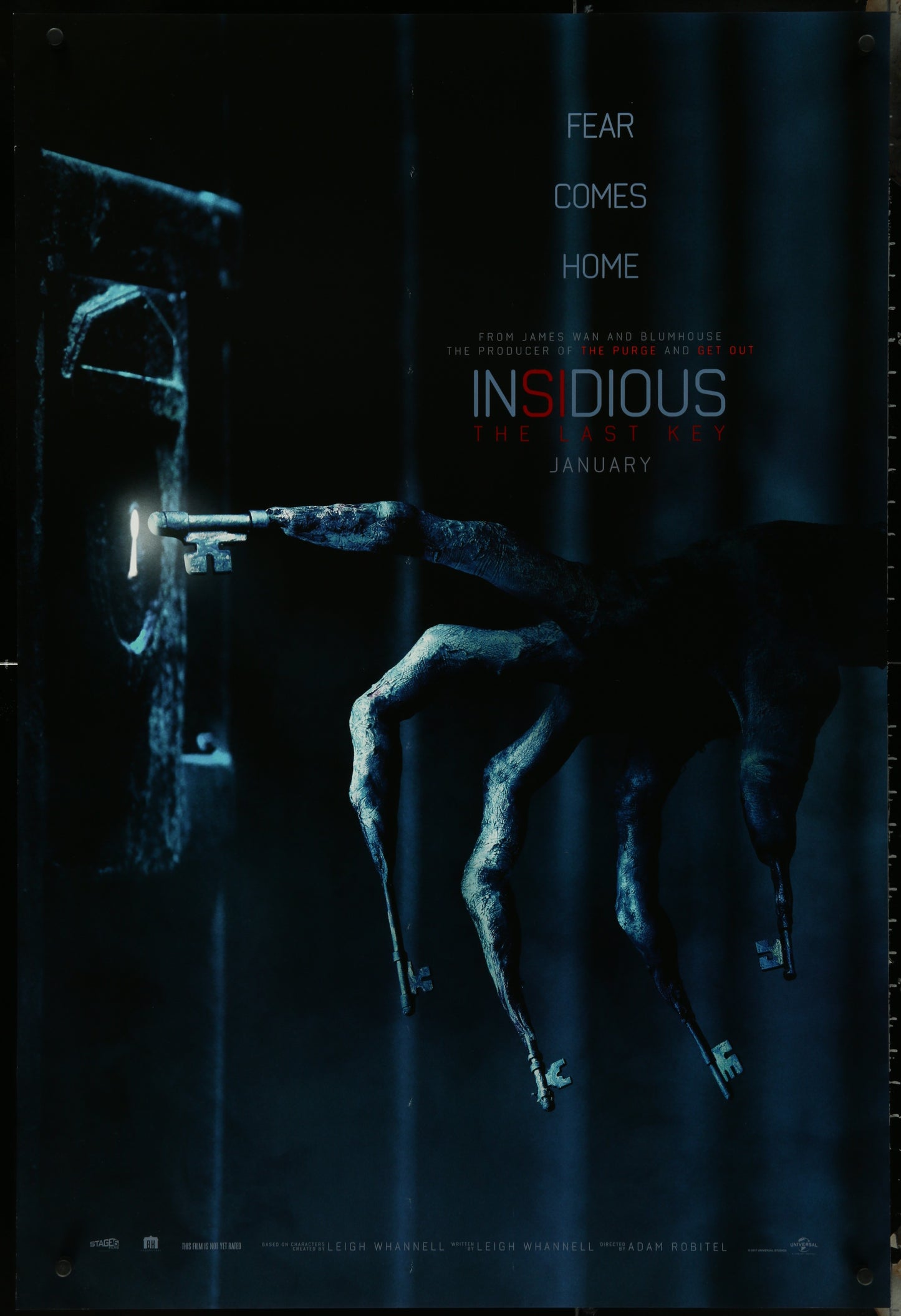 Movie poster for 'Insidious: The Last Key' with a hand reaching through a door