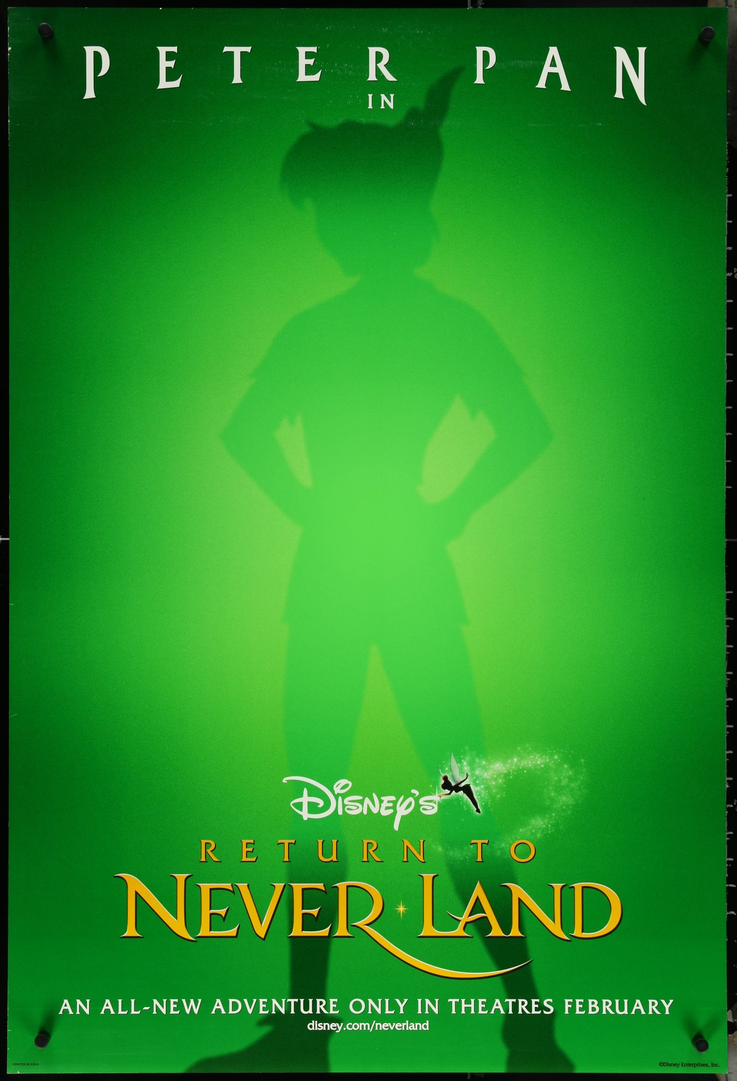 Original US one-sheet movie poster for 'Return to Neverland' featuring a silhouette of Peter Pan against a green background with text and Disney logo.