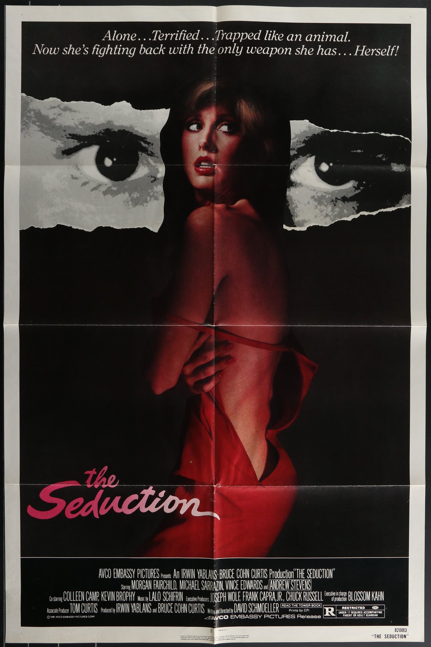 Movie poster for 'The Seduction' with a woman in a red dress and close-up of an eye.