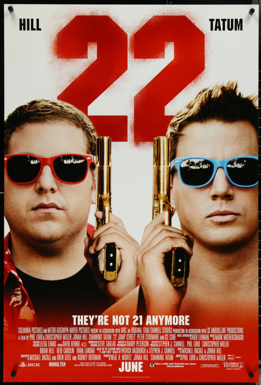 An original US one-sheet movie poster for the film '22 Jump Street' featuring images of the actors Jonah Hill and Channing Tatum with sunglasses and guns.