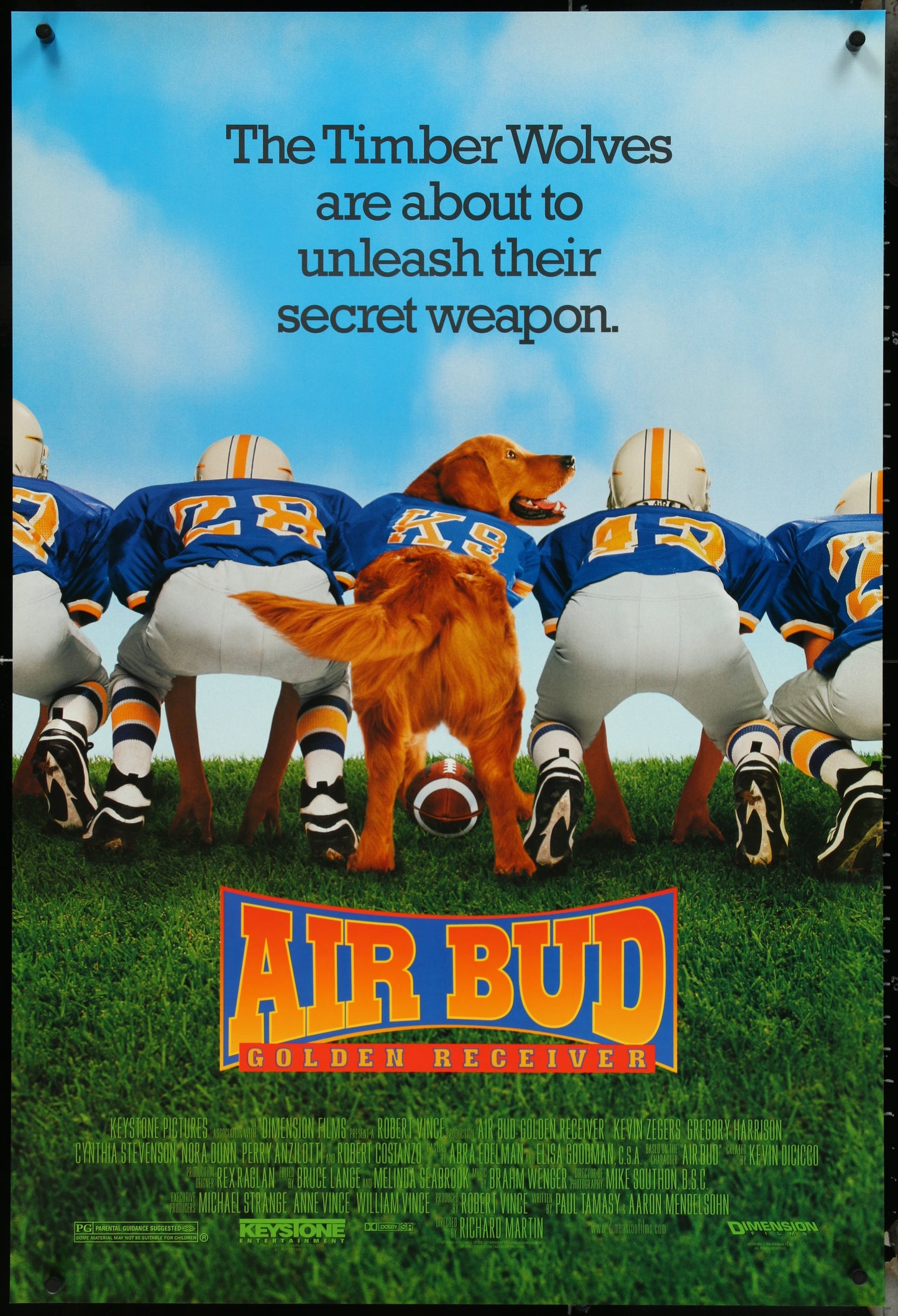 Movie poster for 'Air Bud: Golden Receiver' featuring a dog in a football uniform with text about the Timber Wolves.