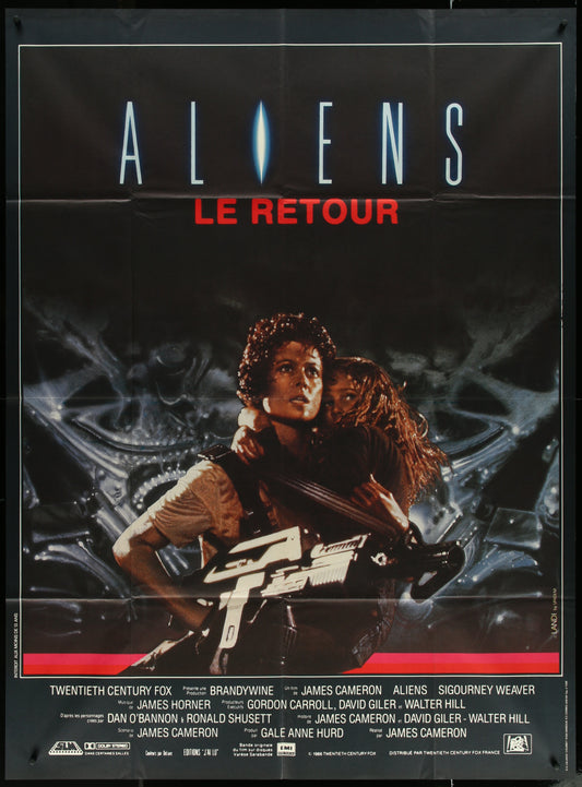 A vintage French one-panel movie poster for the film 'Aliens' featuring characters from the movie with the title 'Le Retour' at the top.