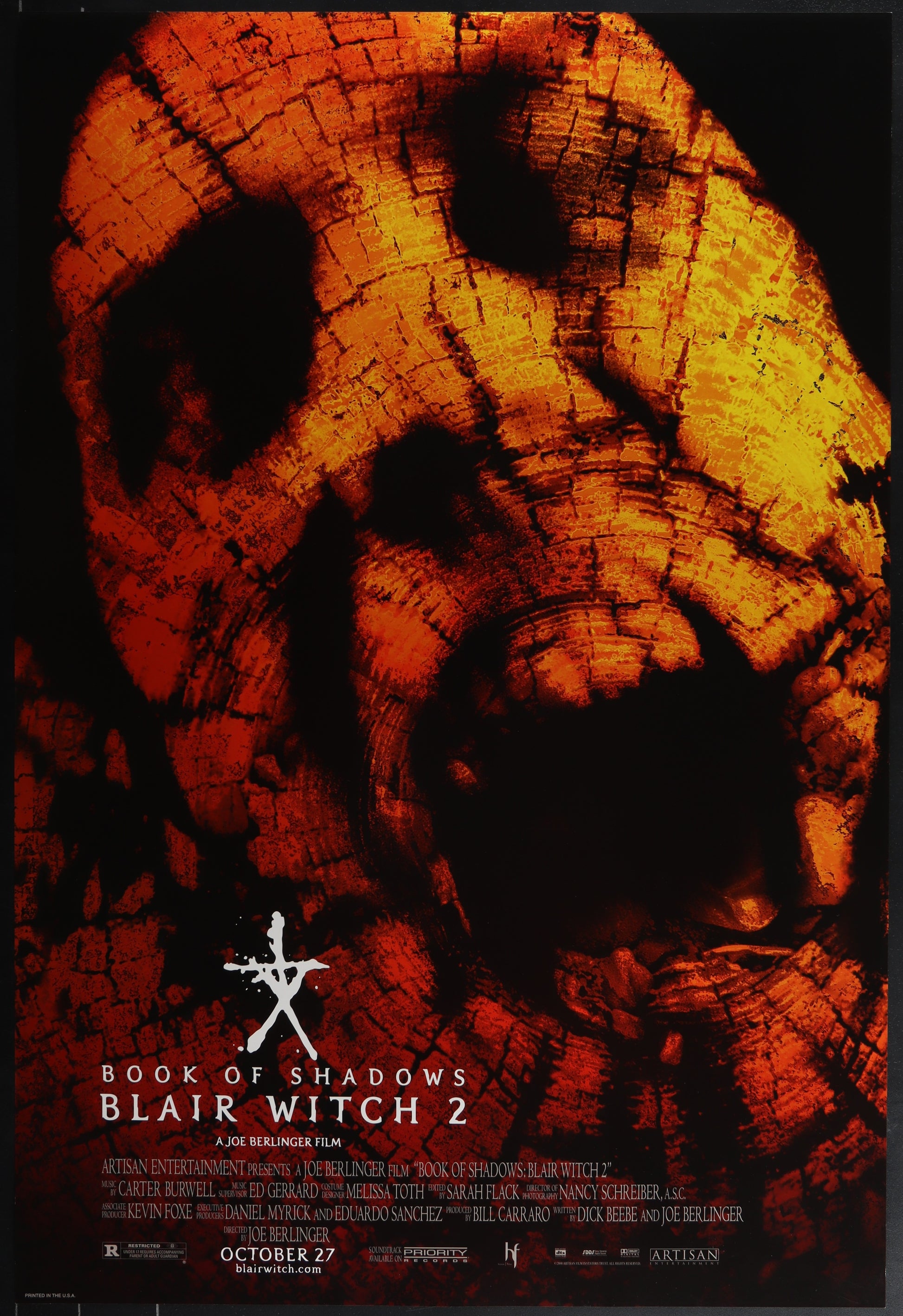 Original US one-sheet movie poster for Book of Shadows: Blair Witch II featuring a stylized, distorted face on a background that resembles a wooden surface with visible nails.