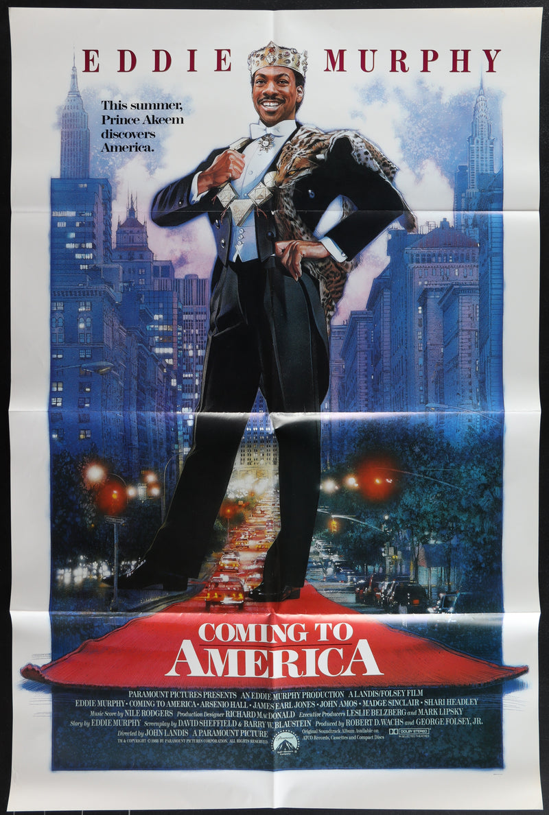 Movie poster for 'Coming to America' featuring Eddie Murphy on a city street.