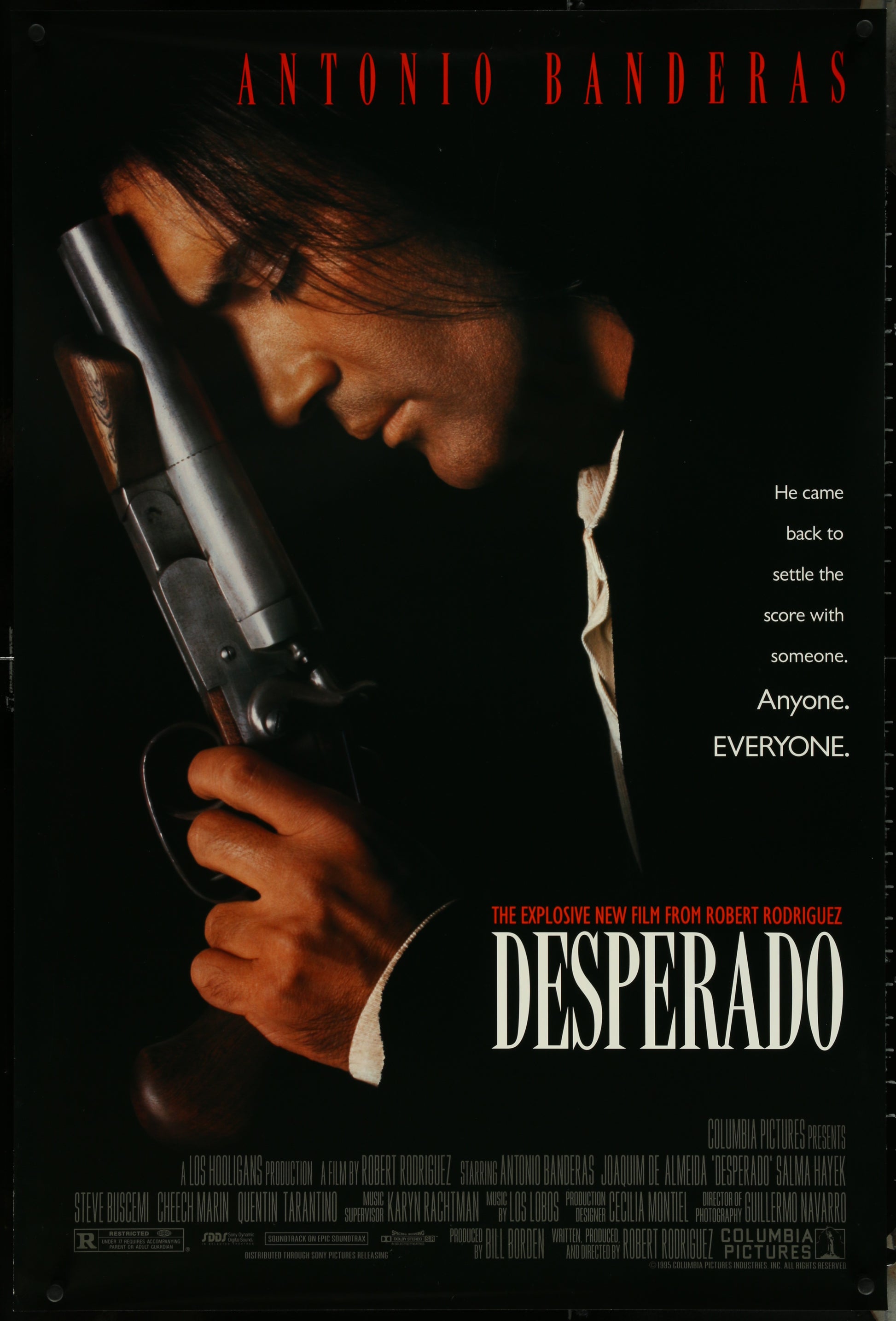 Movie poster for 'Desperado' featuring Antonio Banderas holding a gun.