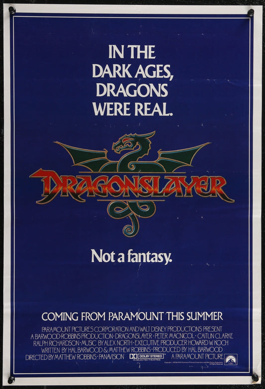 Vintage movie poster for 'Dragonslayer' featuring a green dragon design and the text of the movie title along with a quote.