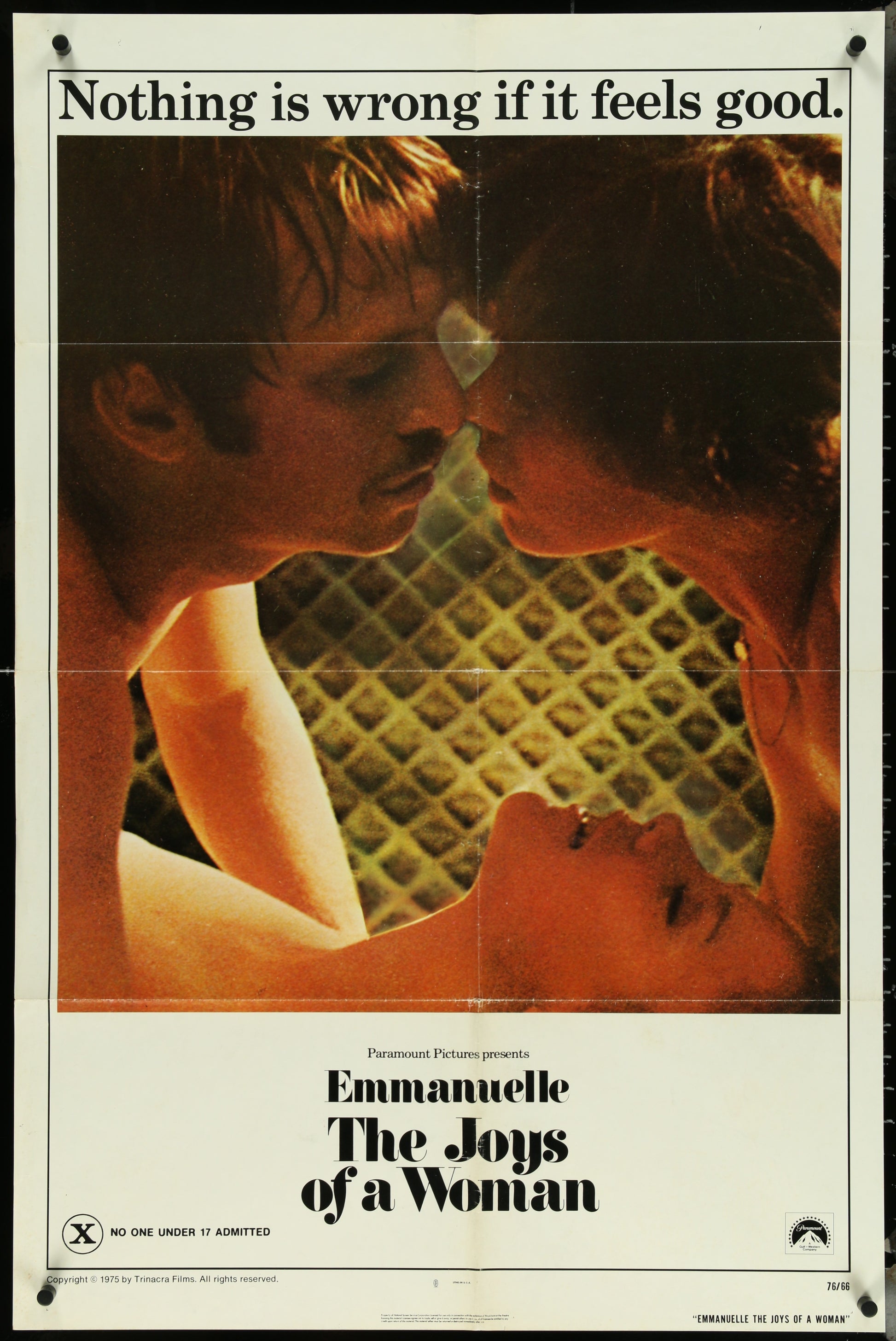 Original US one sheet movie poster for 'Emmanuelle - The Joys Of A Woman' featuring a close-up of two people kissing with the movie title and text at the top.