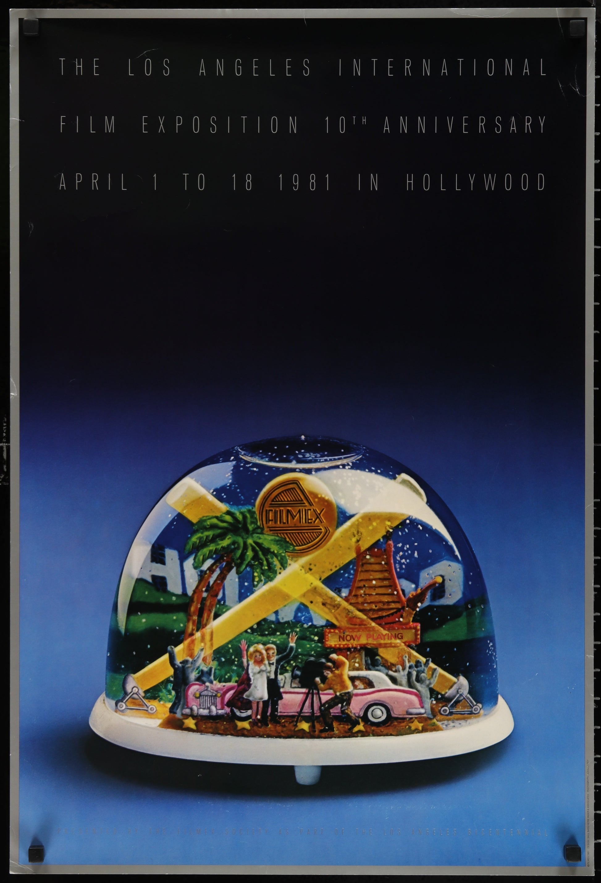 Vintage poster for the Los Angeles International Film Exposition, featuring a snow globe scene with Hollywood-related imagery, and text indicating the event's history and location.