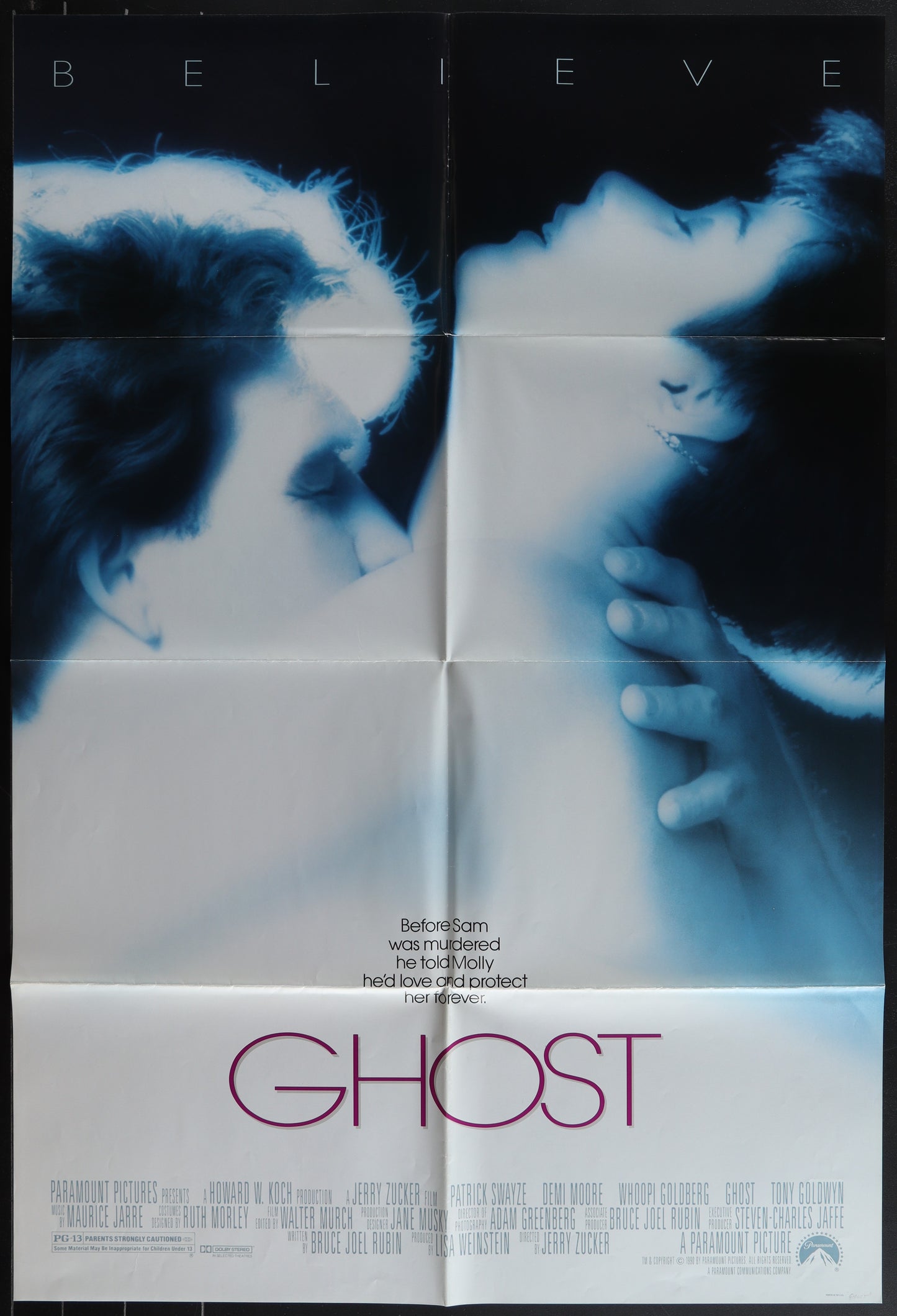 An original one-sheet movie poster for the film 'Ghost' featuring images of the main characters, Patrick Swayze and Demi Moore, in a romantic pose.
