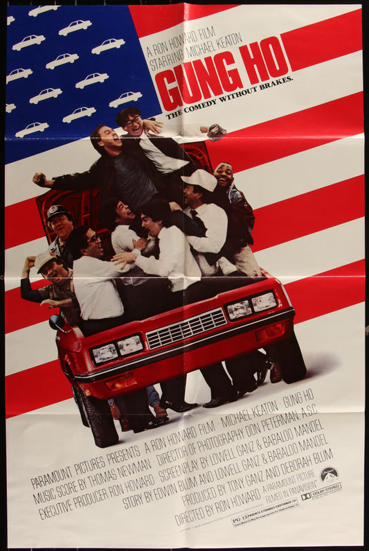 Vintage movie poster for 'Gung Ho' featuring a group of people on a red car with a background of an American flag.