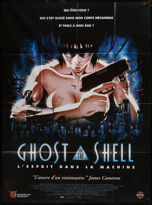 Movie poster for 'Ghost in the Shell' featuring a character holding a gun with a cityscape in the background.