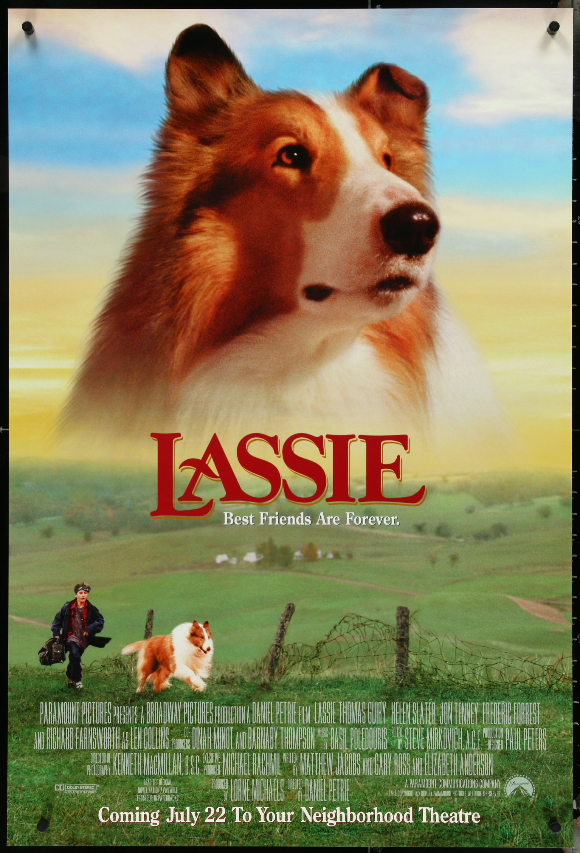 Movie poster for 'Lassie' with a collie dog and a person in a field.