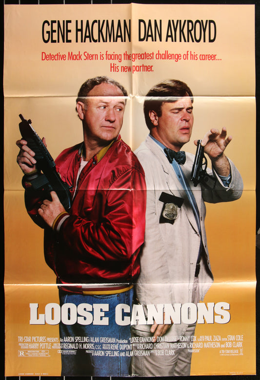 Movie poster for 'Loose Cannons' featuring two men with weapons and text about a detective's challenge.