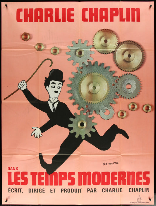 Vintage French one-panel movie poster for 'Modern Times' featuring Charlie Chaplin with a background of gears and text.