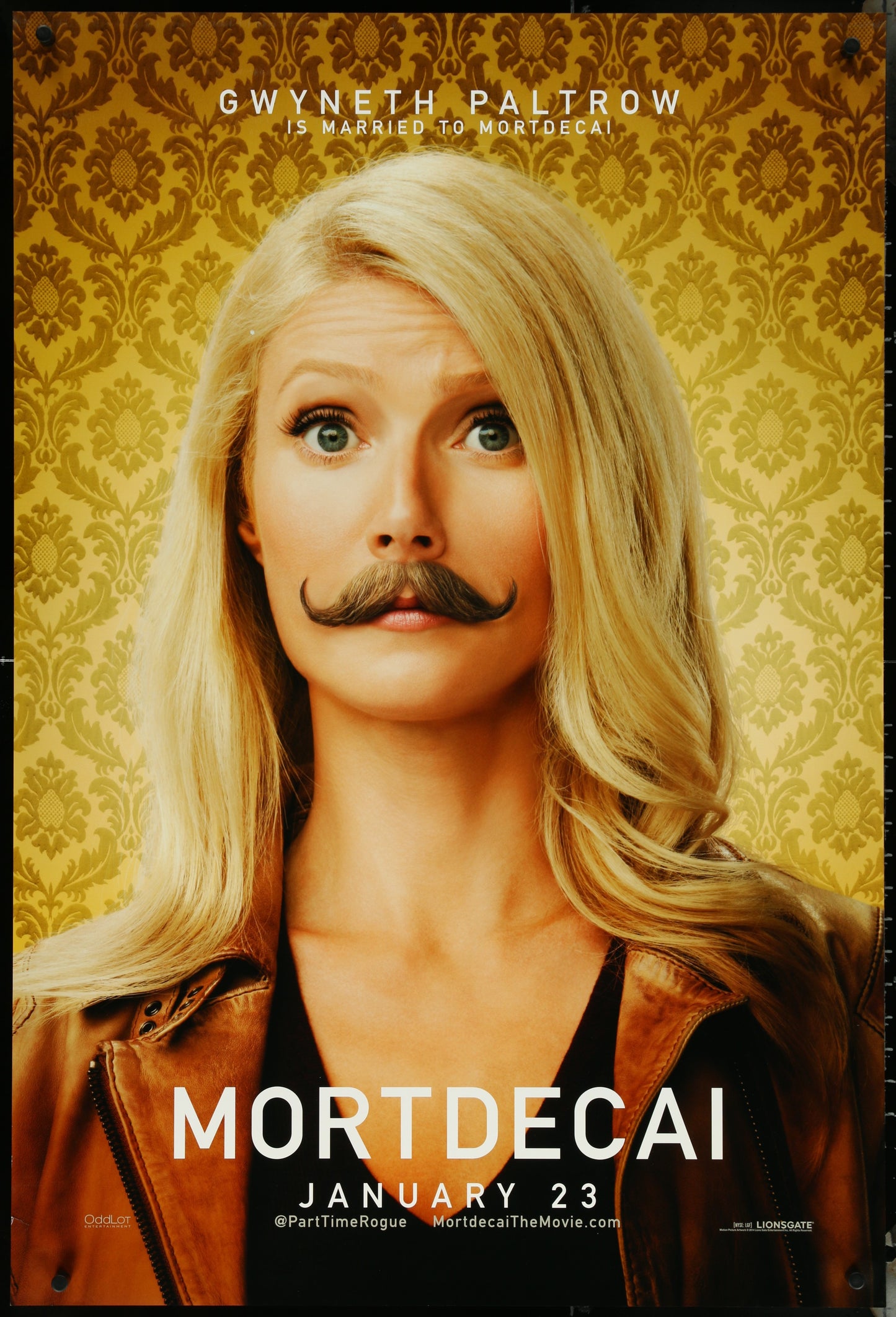 A movie poster featuring Gwyneth Paltrow with a mustache, in a brown jacket and white shirt, for the film 'Mortdecai'.