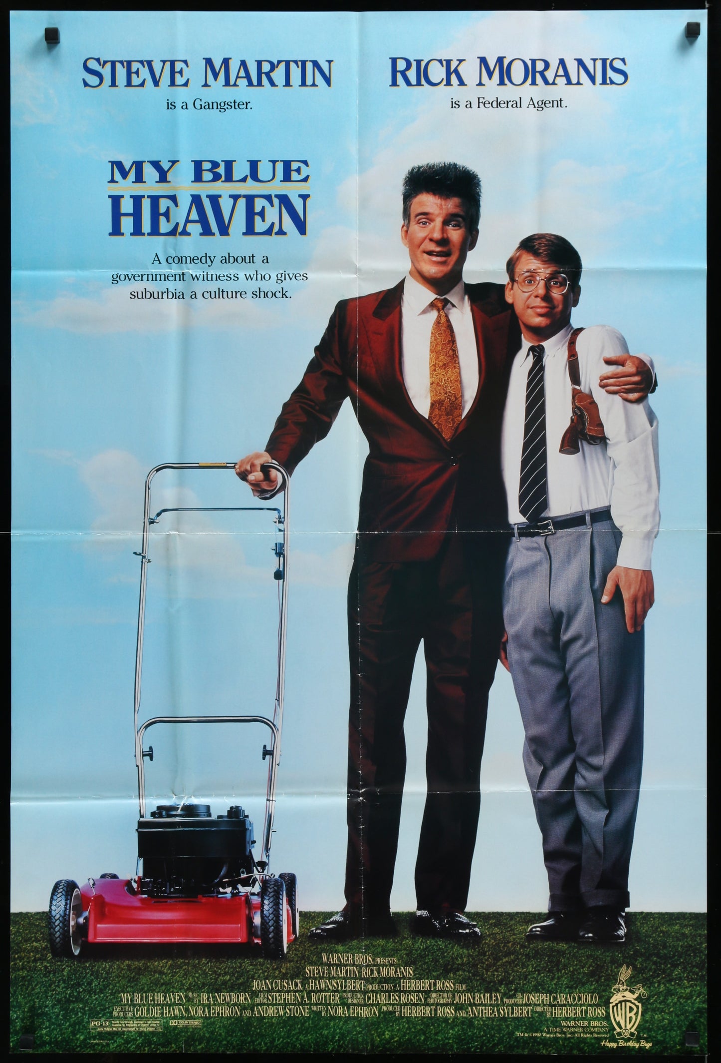 A vintage one-sheet movie poster for 'My Blue Heaven' featuring two male characters, with one in a suit and the other in a tie, standing in front of a blue sky background. The poster is folded and shows signs of wear.