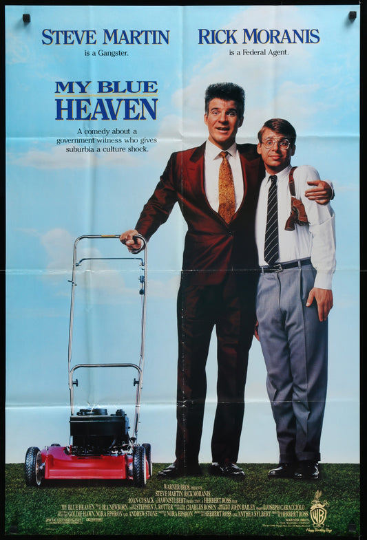 A vintage one-sheet movie poster for 'My Blue Heaven' featuring two male characters, with one in a suit and the other in a tie, standing in front of a blue sky background. The poster is folded and shows signs of wear.
