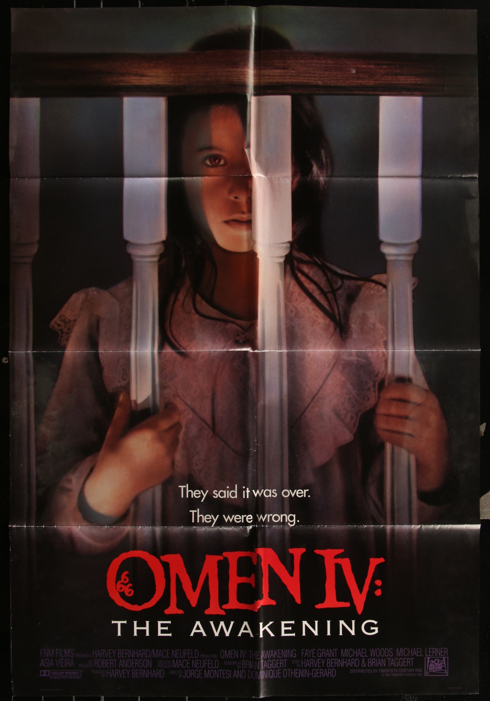 Original US one-sheet movie poster for Omen IV: The Awakening featuring a woman in a distressed pose with a superimposed text overlay.