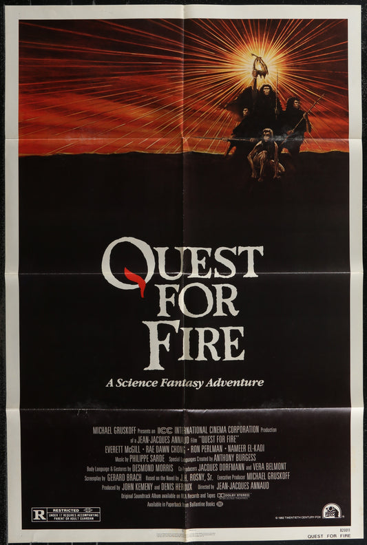 Movie poster for 'Quest for Fire' with a dramatic sunset scene and text.