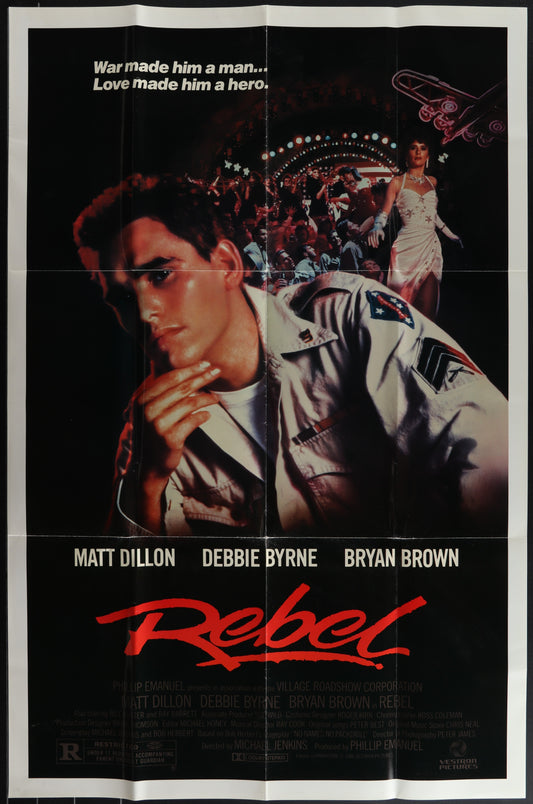 Vintage movie poster for 'Rebel' featuring a man in a military uniform with the text 'Matt Dillon' and the title 'REBEL' prominently displayed.
