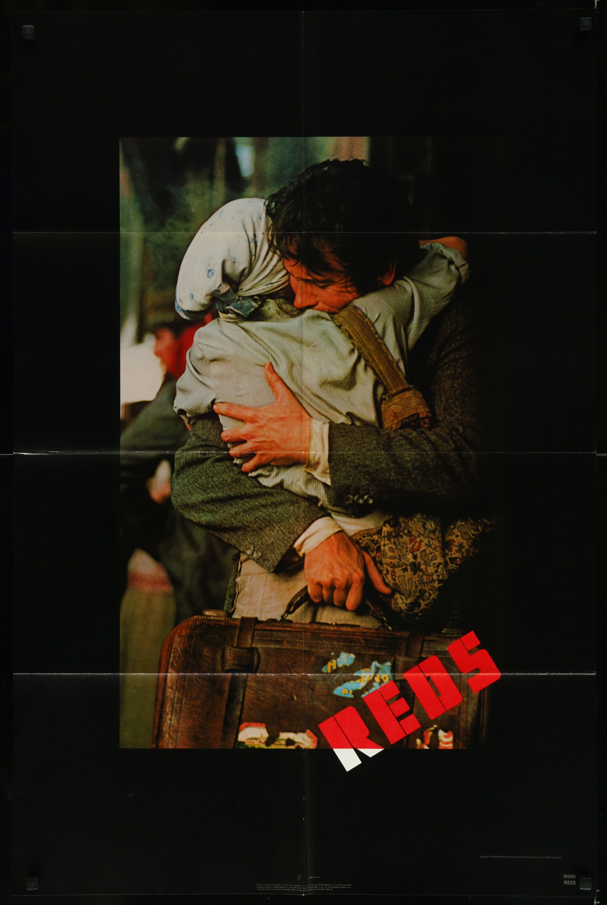 A 1981 US One Sheet Movie Poster for the film 'Reds' featuring an image of a man and a woman embracing, with the title 'Reds' printed at the bottom.
