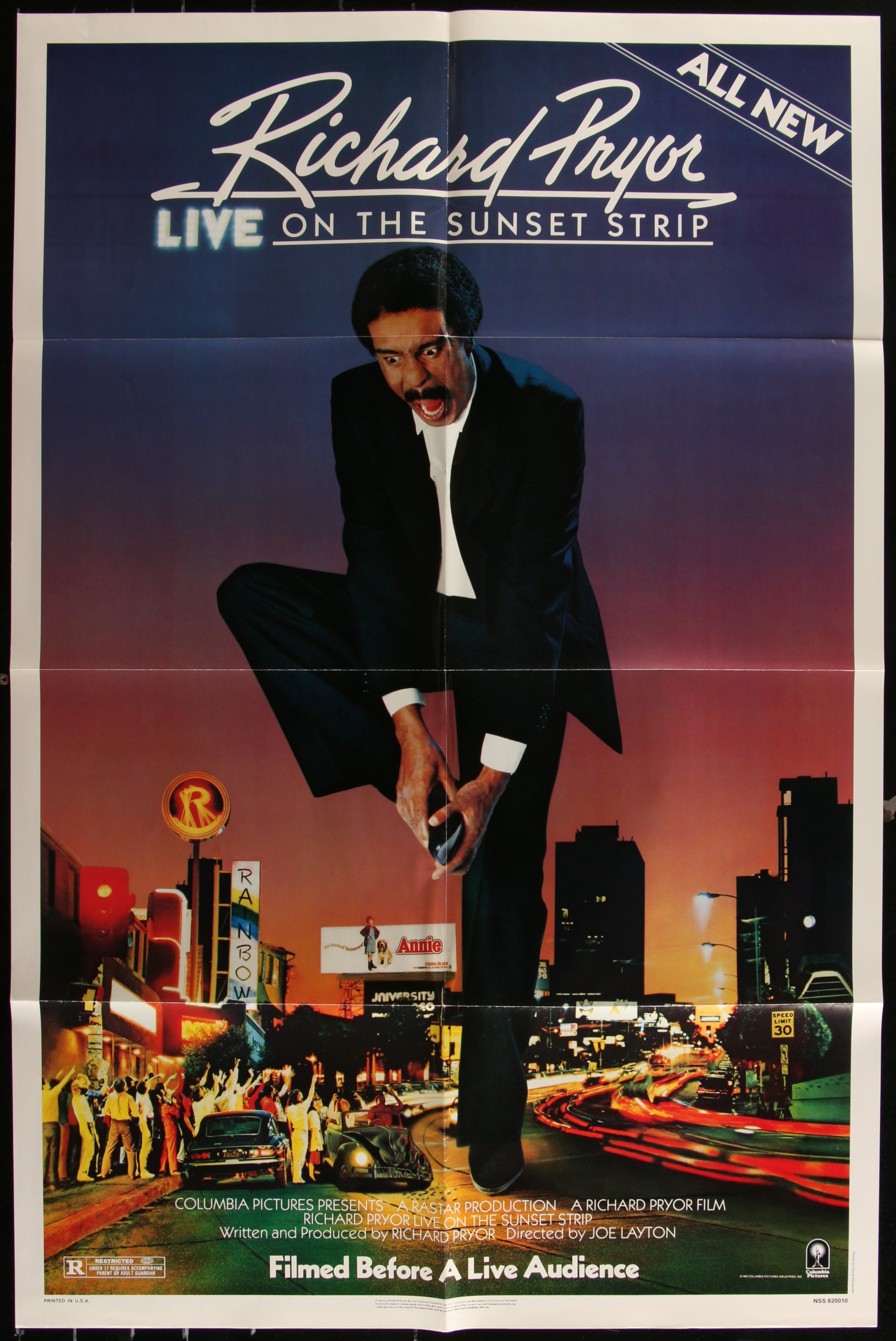 Vintage movie poster for 'Richard Pryor Live On The Sunset Strip' featuring an image of Richard Pryor in a city setting at dusk, with a sign for 'Sunset Strip' in the background.