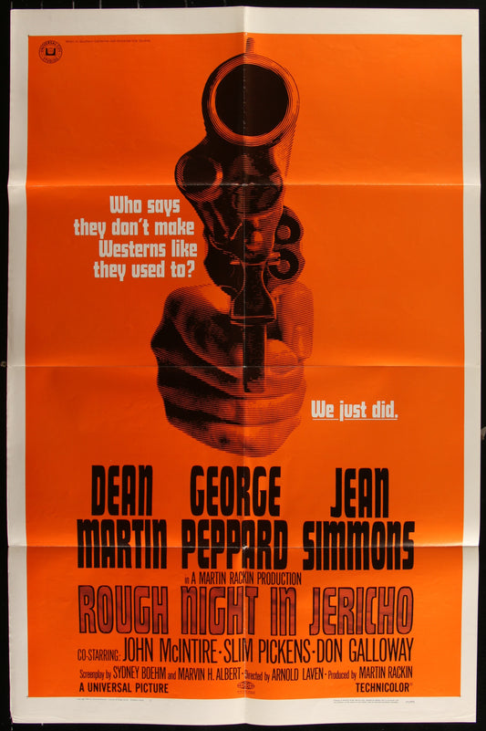 Original US one sheet movie poster for 'Rough Night In Jericho' featuring a gun and the names of the stars, Dean Martin, George Peppard, and Jean Simmons, with a orange and black color scheme.