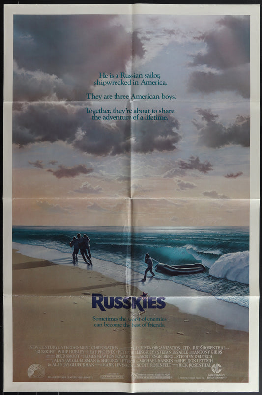 Movie poster for 'Russkies' with a beach scene and text.