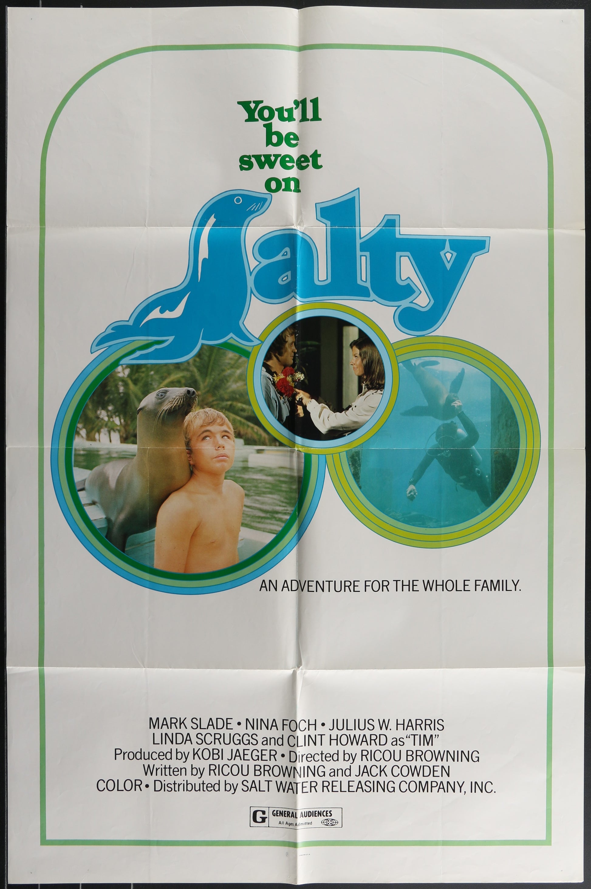 Vintage folded movie poster for 'Salty' featuring images of a boy with a seal and a seal cub, indicating an adventure-family theme.