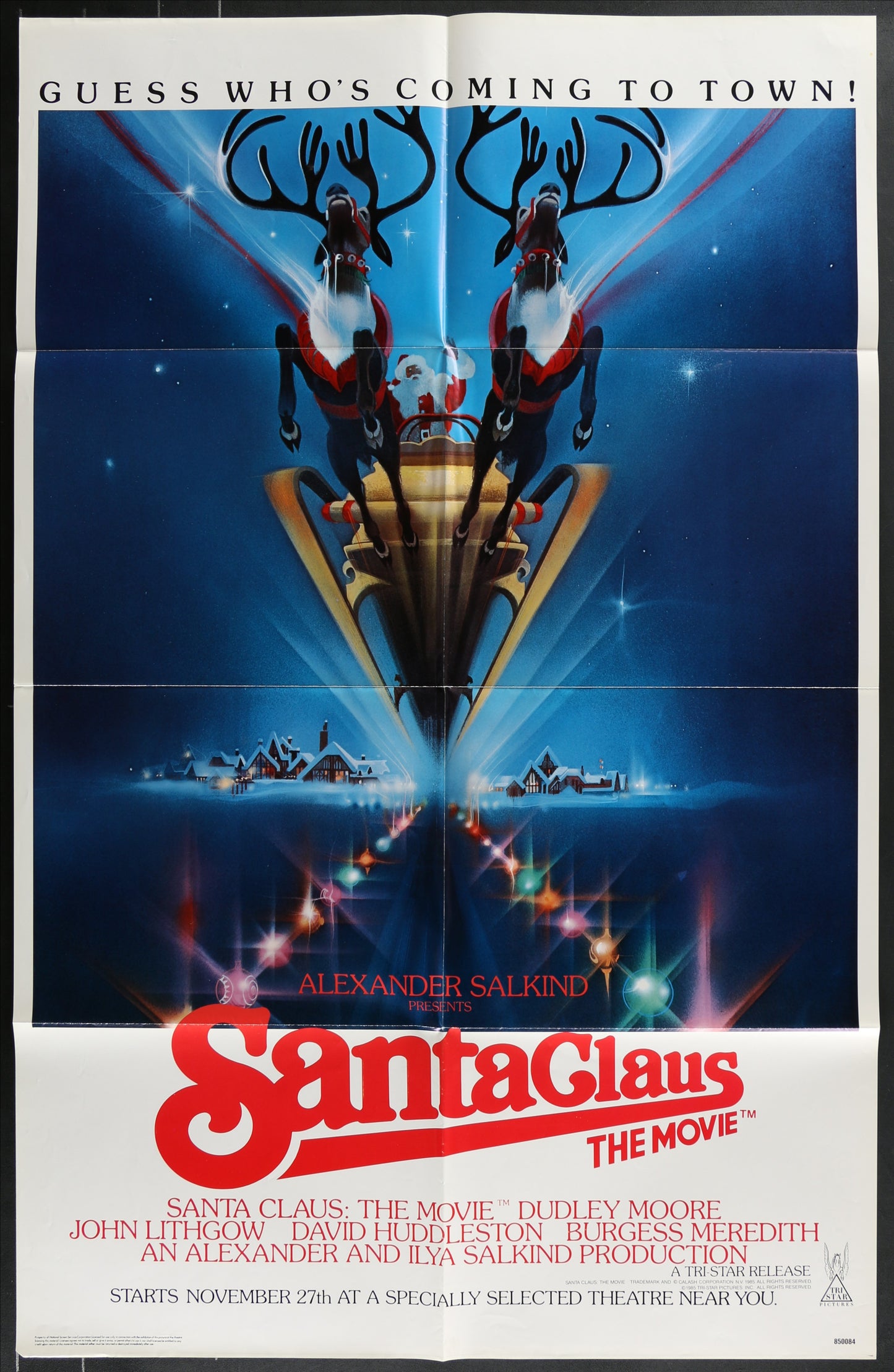 Promotional poster for 'Santa Claus: The Movie' with reindeer and Santa Claus figure.