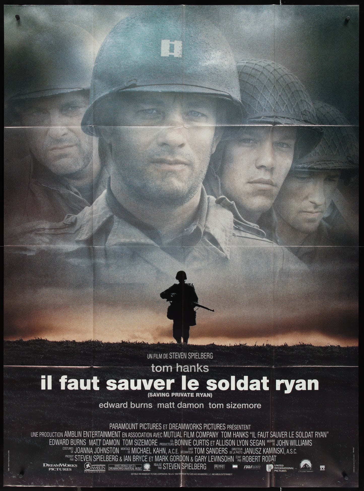 A vintage French one-panel movie poster for 'Saving Private Ryan' featuring a black and white image of the main character with a background of other soldiers in the background.