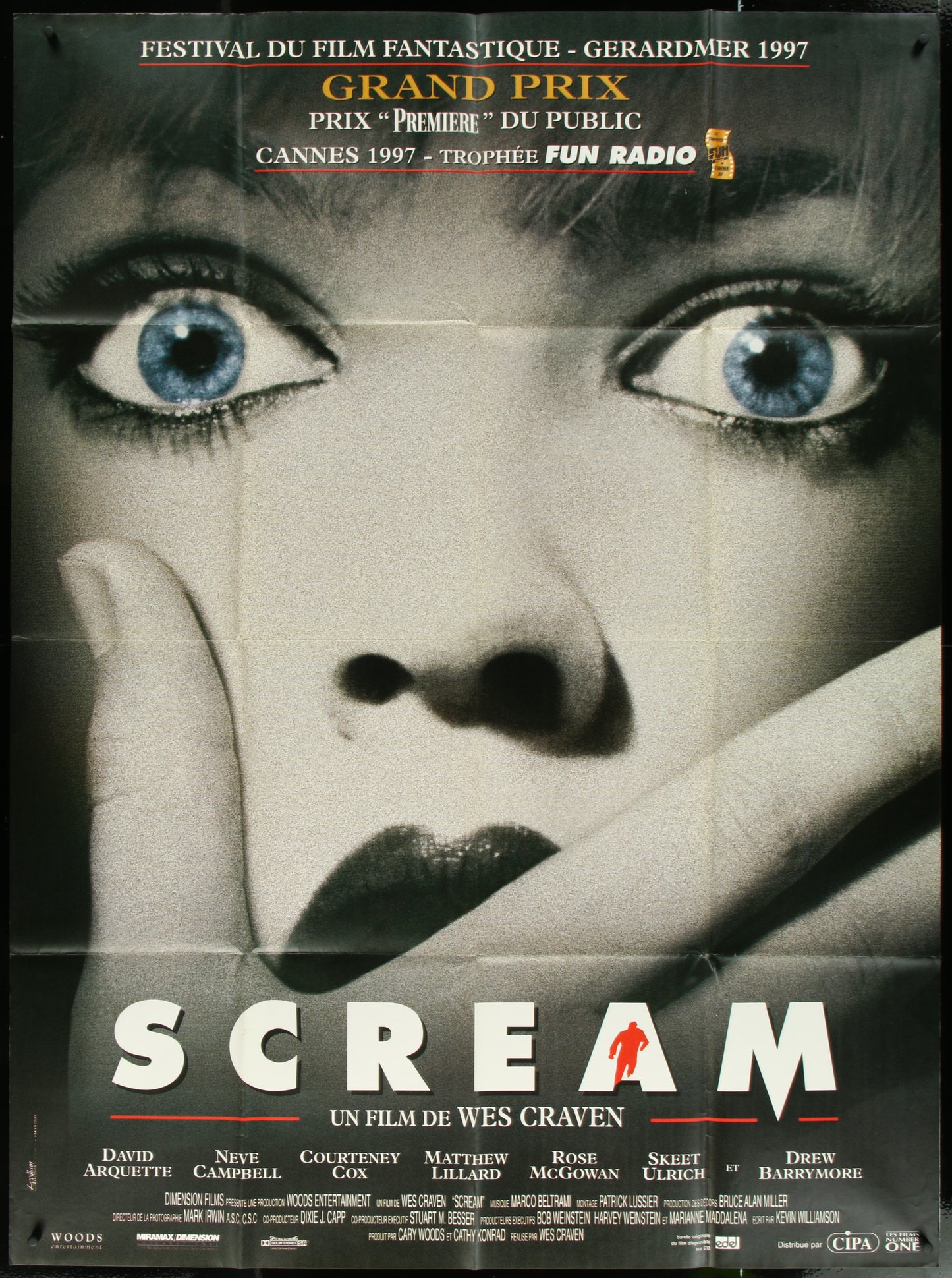 Original folded French one-panel movie poster for 'Scream' (1996) featuring a close-up of a female character with a screaming facial expression, set against a dark background with text and smaller images of the main actors.