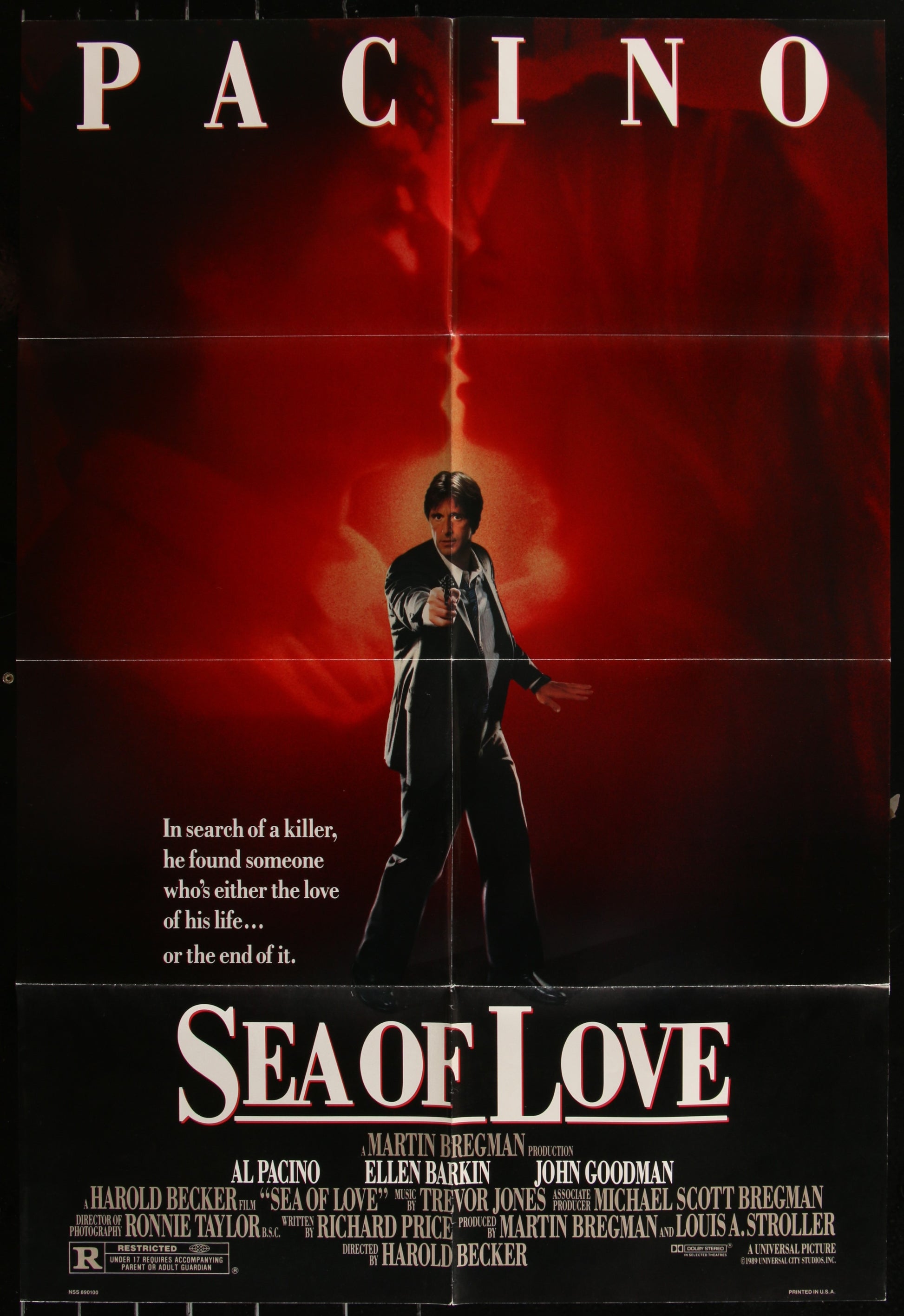 A vintage one-sheet movie poster for 'Sea of Love' featuring a man in a black suit with a red and black background.