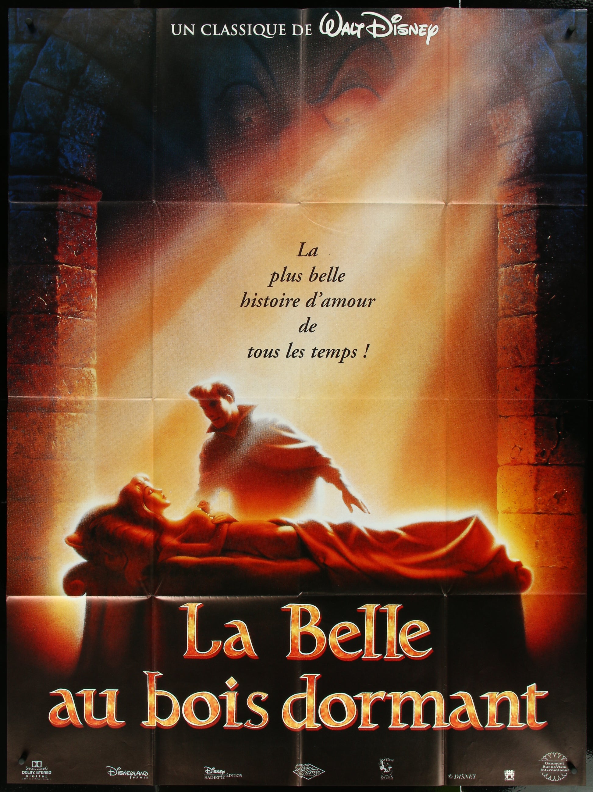 A vintage movie poster for 'Sleeping Beauty' featuring an illustration of a female character presumably Princess Aurora, lying on a bed with a male character standing beside her, with a warm orange and yellow color palette.