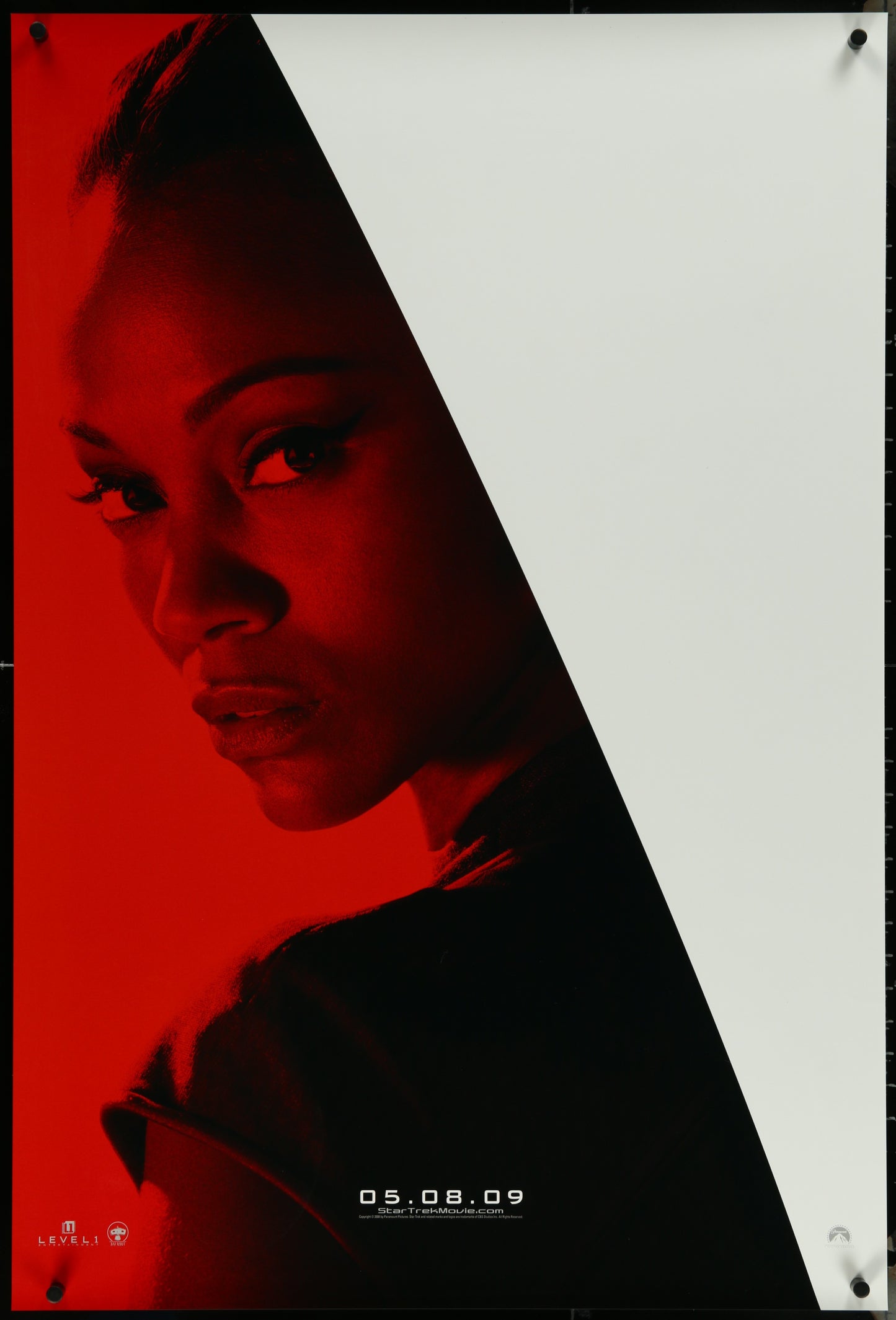 Original US one-sheet movie poster for Star Trek (2009) featuring a red and white design with a photograph of the actress Zoe Saldana at the bottom.