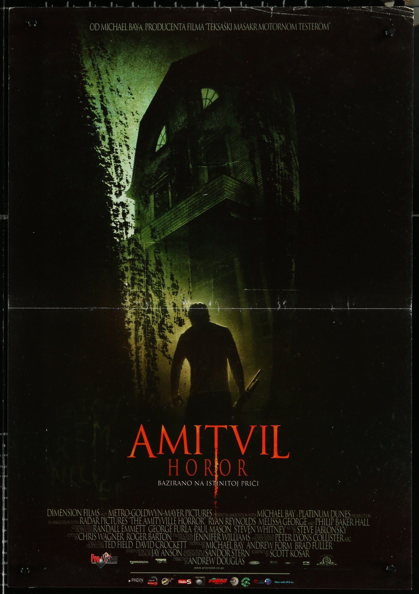 Vintage movie poster for 'Amityville Horror' featuring a dark, eerie image of a house at night with a silhouetted figure in the foreground.
