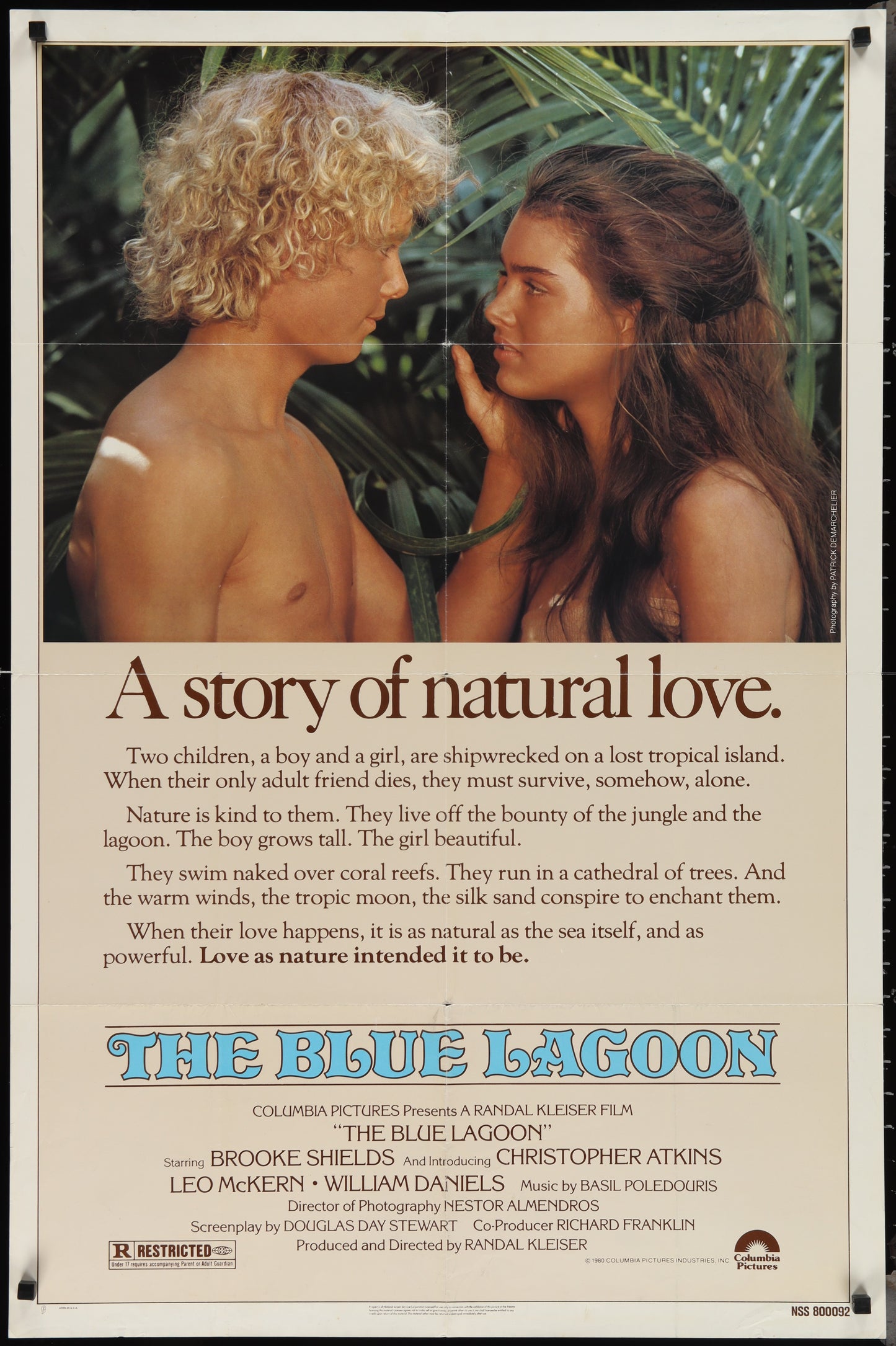 Vintage movie poster for 'The Blue Lagoon' featuring two people on the beach, with text detailing the film's title and a brief description.