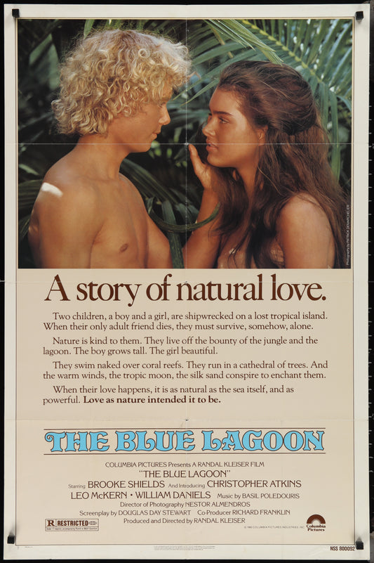 Vintage movie poster for 'The Blue Lagoon' featuring two people on the beach, with text detailing the film's title and a brief description.