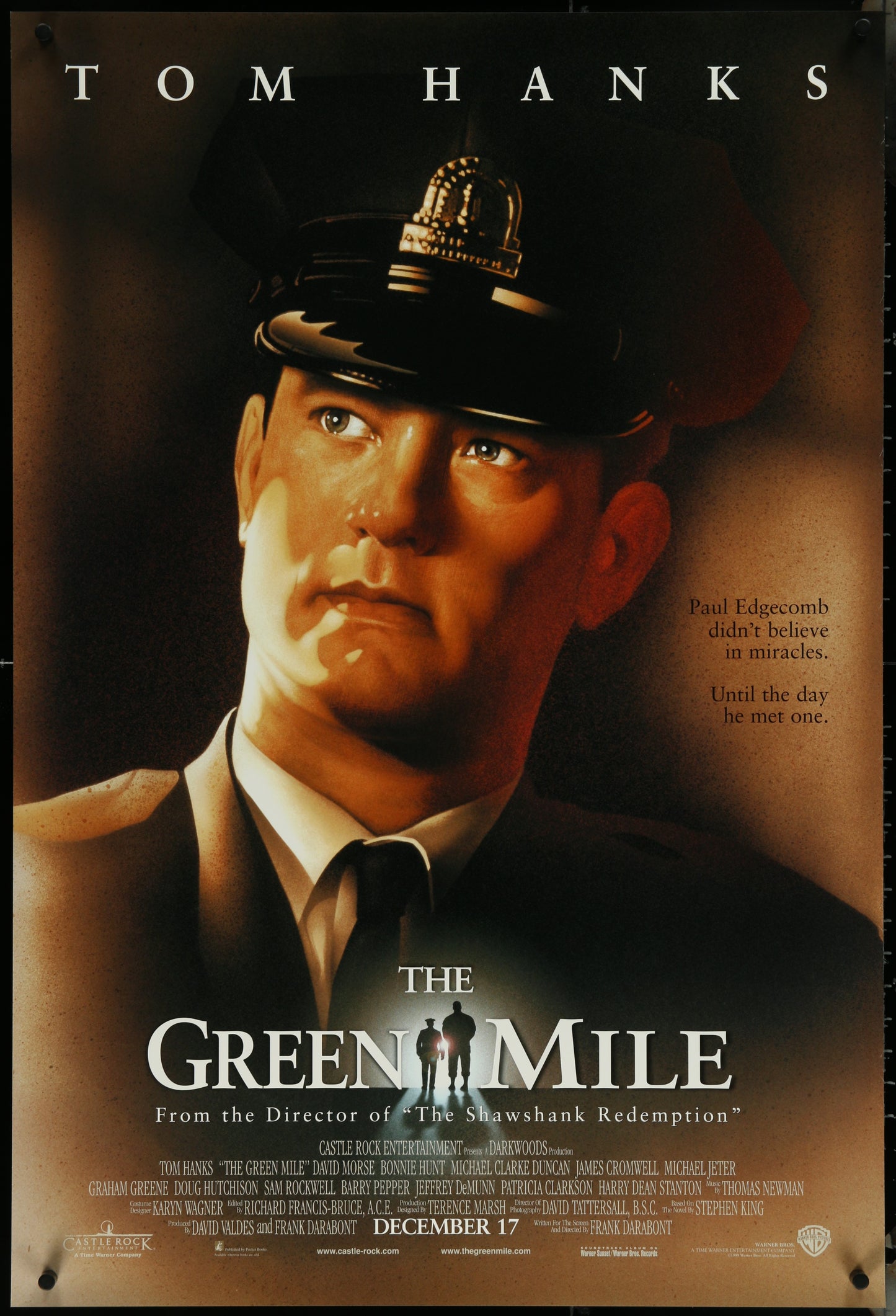 The Green Mile movie poster featuring Tom Hanks in a prison guard uniform, with the title and release date at the bottom.