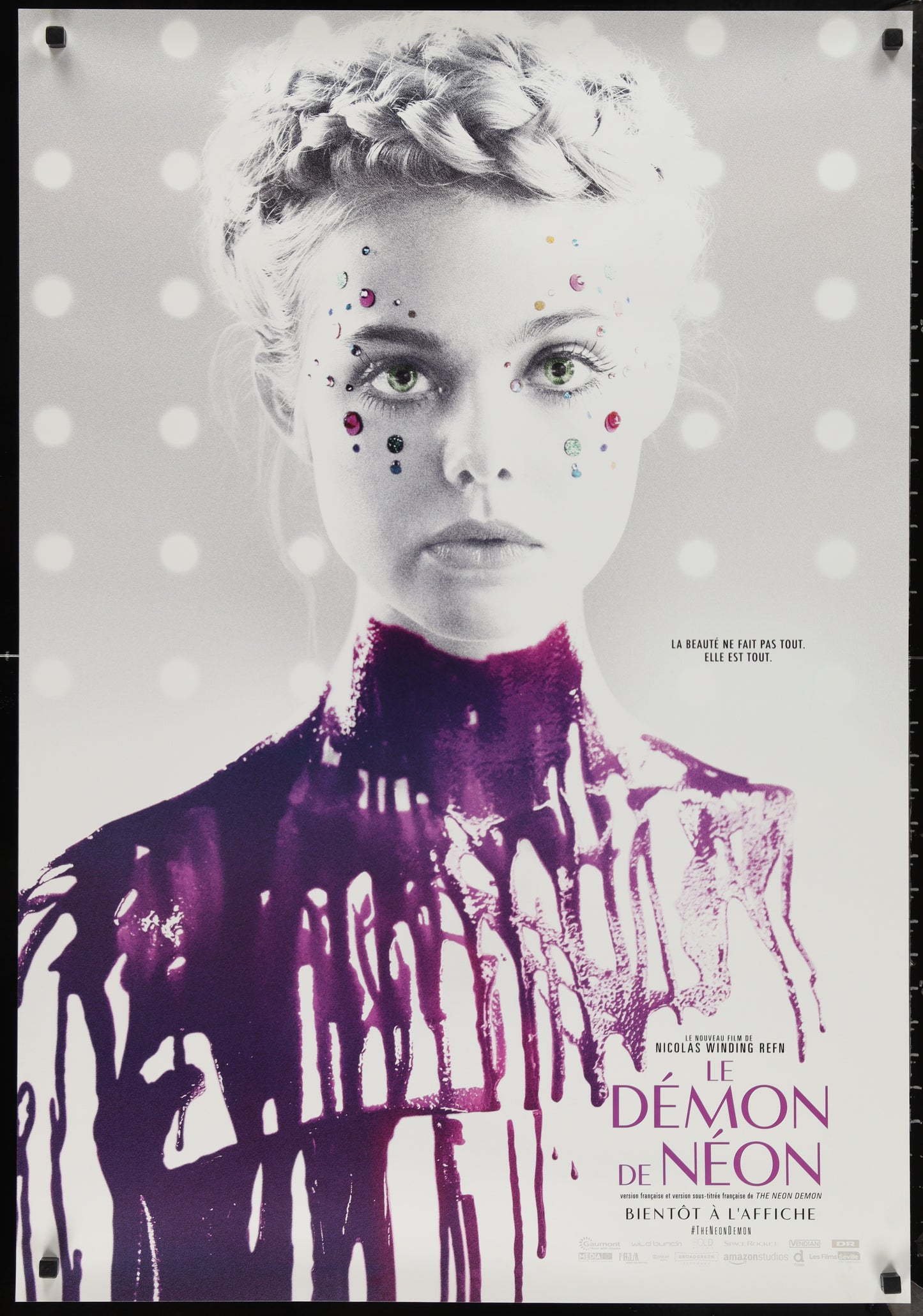 Poster of a woman with a polka dot background and purple accents