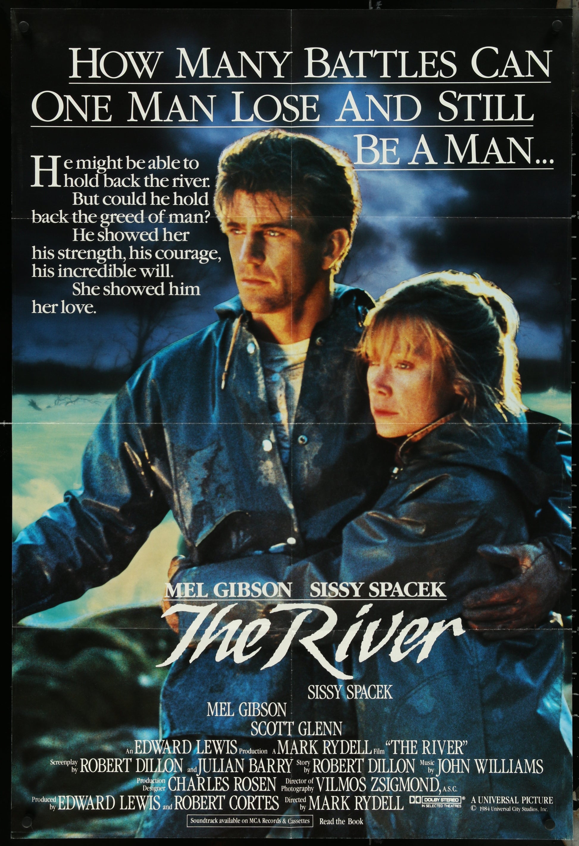 Vintage folded one-sheet movie poster for 'The River' featuring images of the main characters Sissy Spacek and Mel Gibson, with a dark, dramatic background.