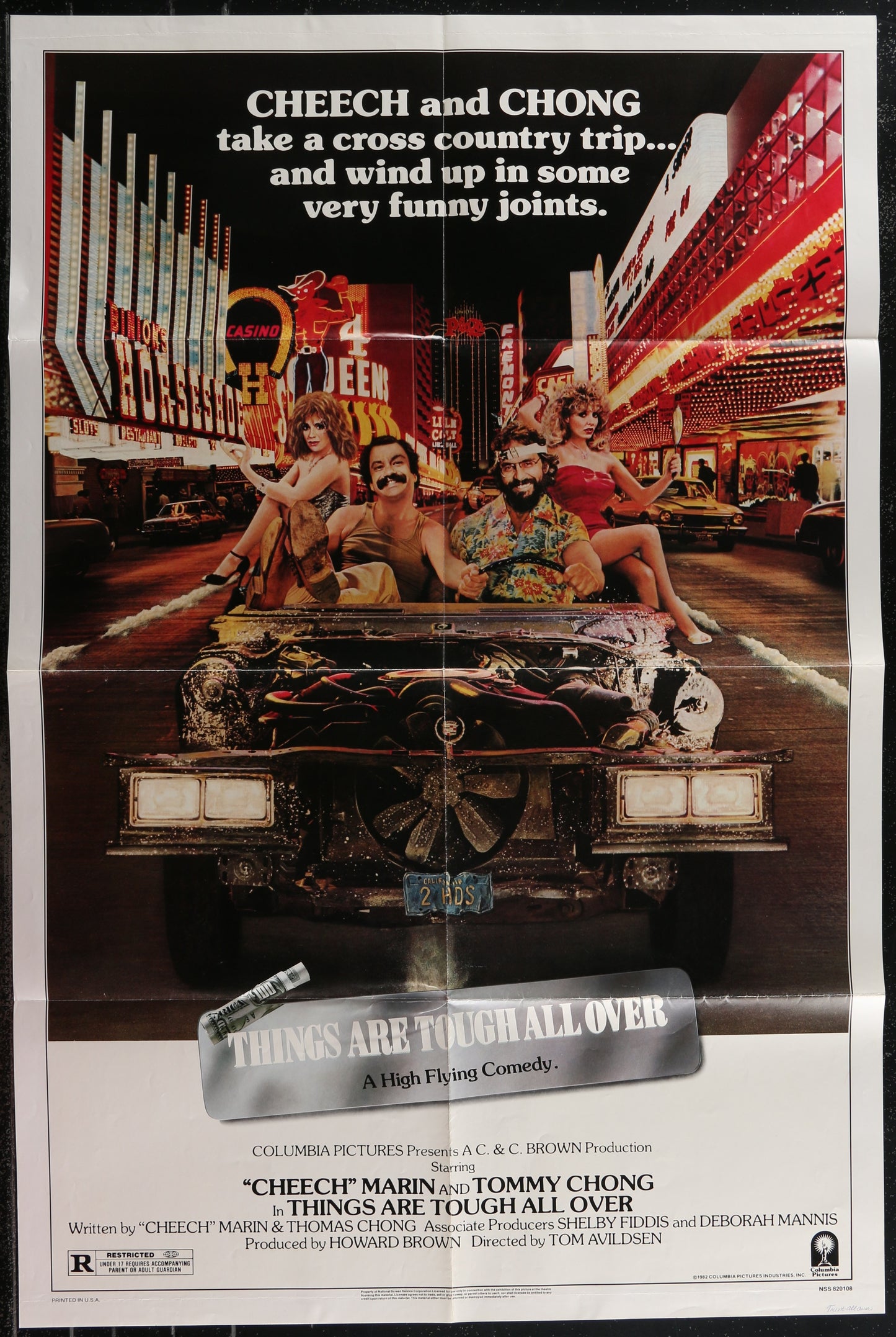 Movie poster for 'Things Are Tough All Over' featuring Cheech and Chong in a car with a cityscape background.