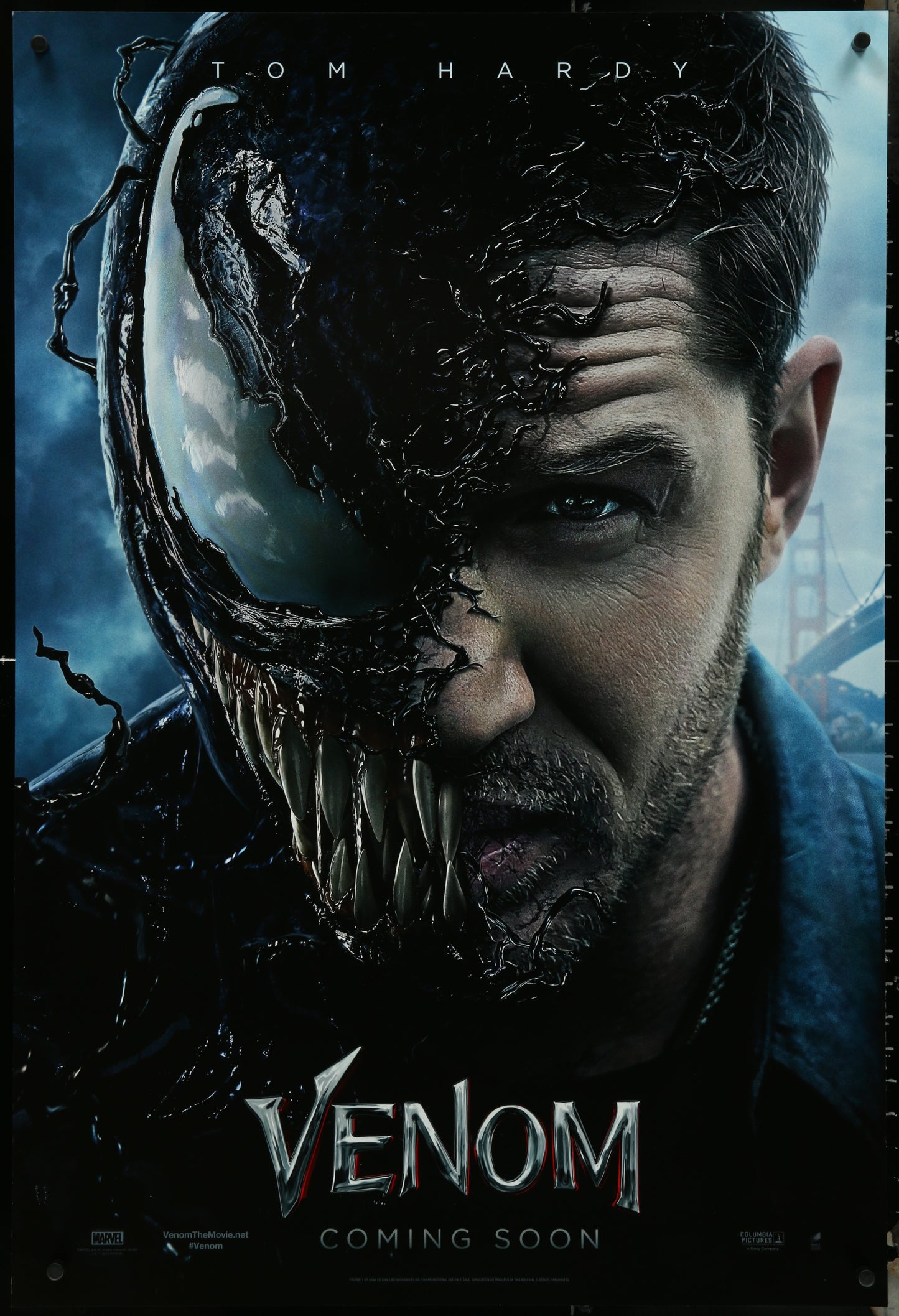 A promotional movie poster for 'Venom' featuring a split image of the character Venom with a human face in the foreground, set against a dark background. The poster has a caption that reads 'VENOM' and 'ON HARDY' with a release date at the bottom.